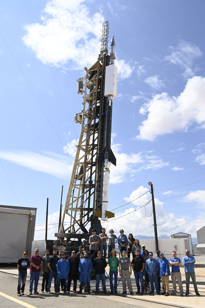 CLASP team with rocket before launch.